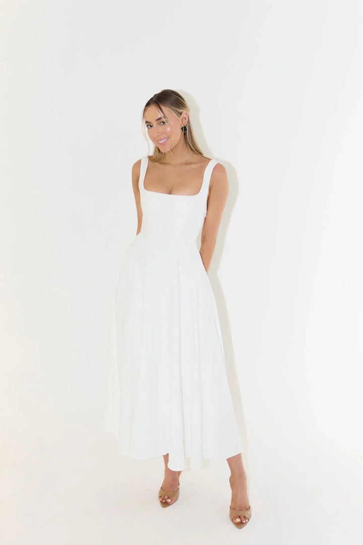 Formal white women's midi dress. Elegant sleeveless cocktail dress with a flattering square neck and flared skirt for events.