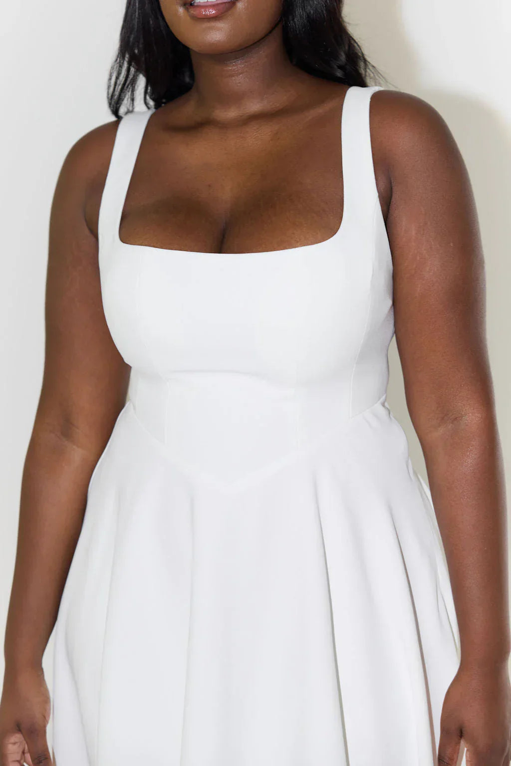 Chic white women's sleeveless midi dress. Elegant cocktail party dress with a stylish square neckline and flattering flared skirt.