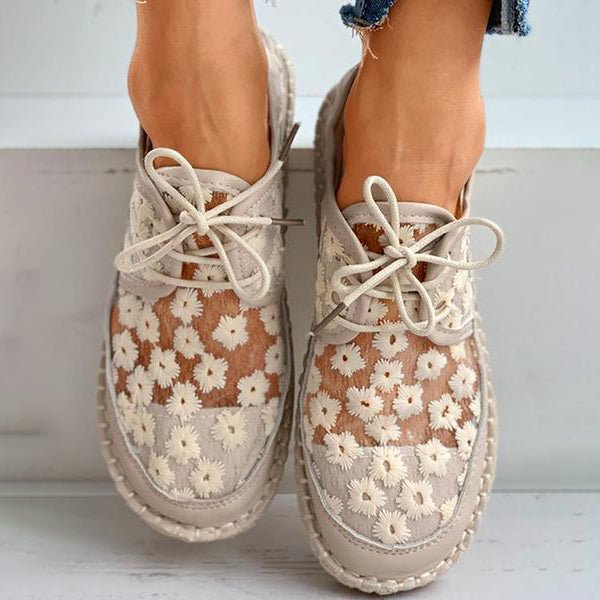Comfortable beige & white women's lace-up sneakers with beautiful floral embroidery & mesh upper.