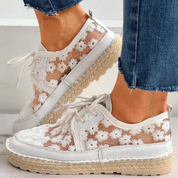 Women's casual floral embroidered white sneakers with breathable mesh & comfortable design.