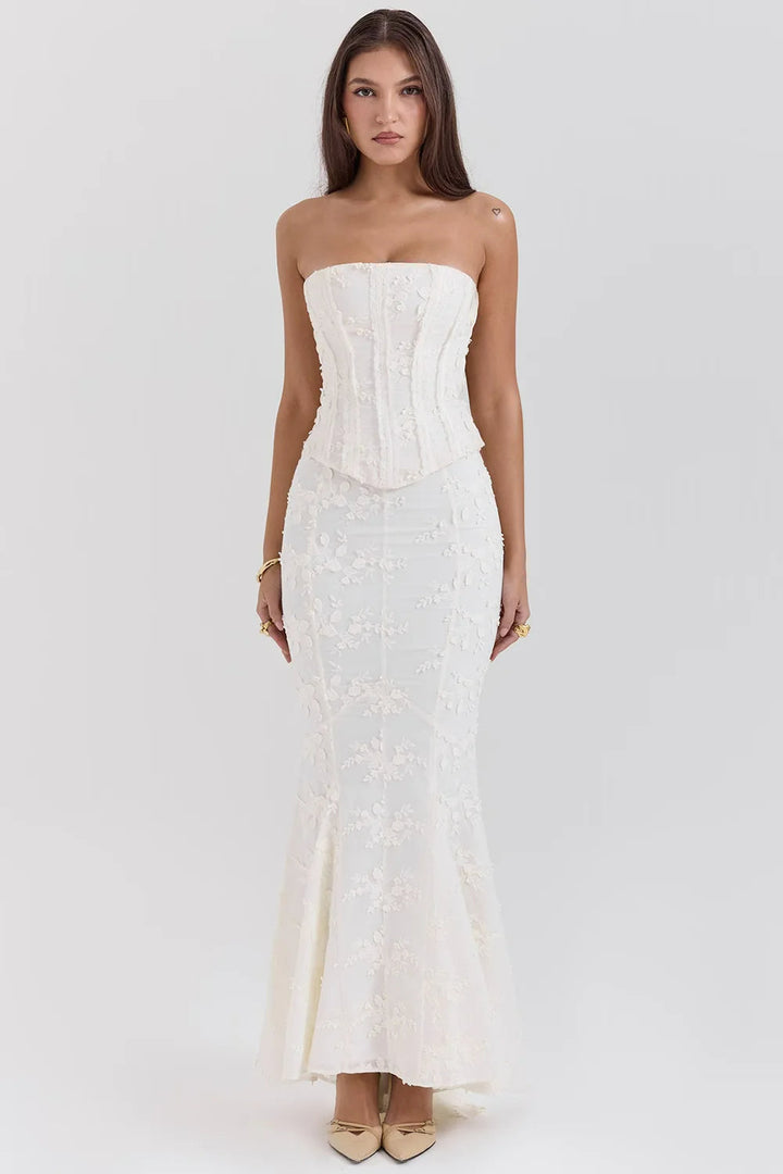 Sophisticated strapless mermaid silhouette maxi dress for women, featuring intricate embroidery details.
