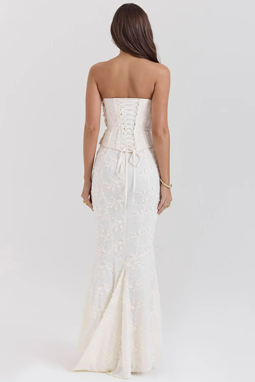 Formal women's strapless white maxi dress, featuring delicate embroidery, perfect for elegant events.