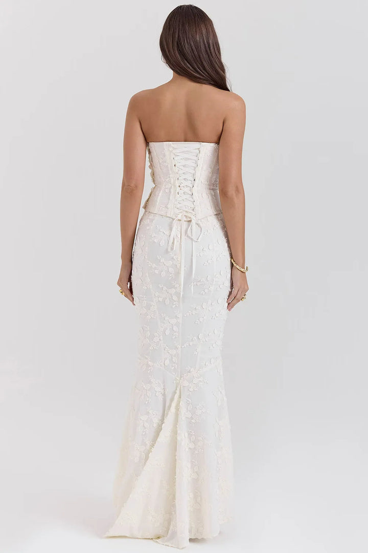 Formal women's strapless white maxi dress, featuring delicate embroidery, perfect for elegant events.
