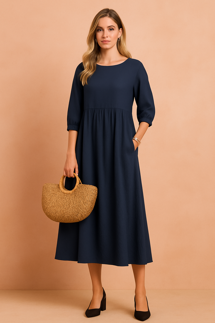 Versatile women's midi dress with 3/4 sleeves. Comfortable and stylish for everyday or office fashion.