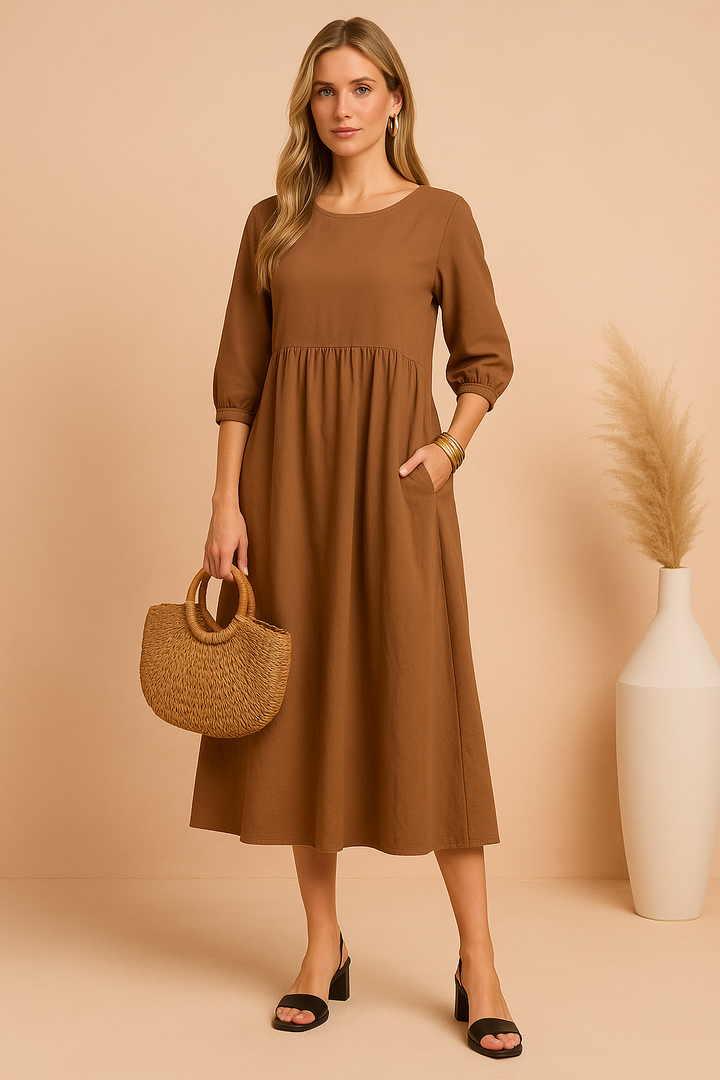Stylish women's midi dress featuring 3/4 sleeves. An elegant and comfortable piece for any occasion.