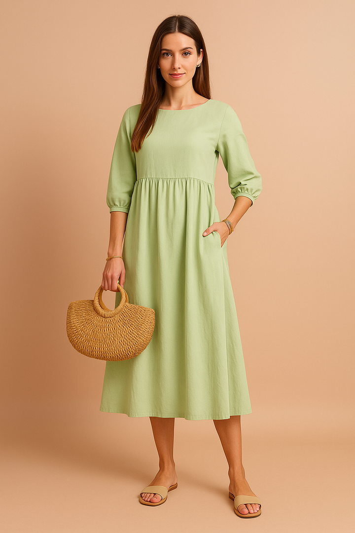 Women's elegant midi dress with practical 3/4 sleeves. A versatile, comfortable addition to your wardrobe.