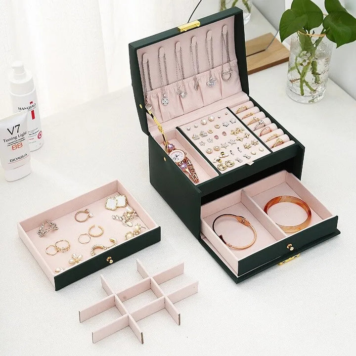 Spacious 3-layer jewelry box for women, ideal for extensive collections of rings, necklaces & bracelets.