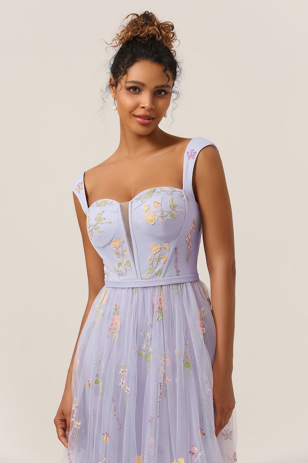 Flowy A-Line formal dress with delicate embroidery, an ideal prom or wedding guest outfit.
