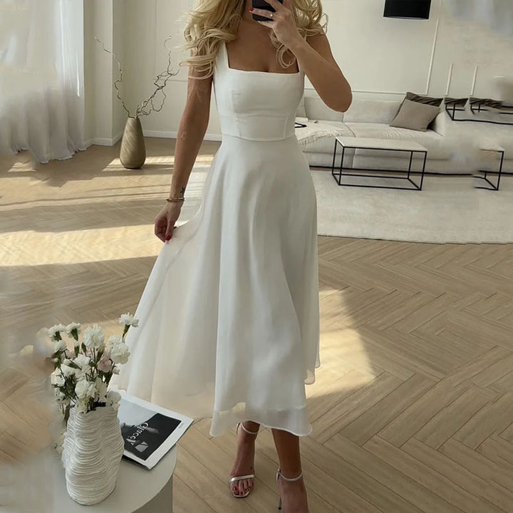 Chic women's A-line midi dress with square neck. Effortlessly flowy & elegant, ideal for versatile summer casual to formal wear.