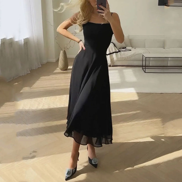 Flowy elegant A-line midi dress for women. Sleeveless design with a stylish square neck, suitable for summer casual or formal.