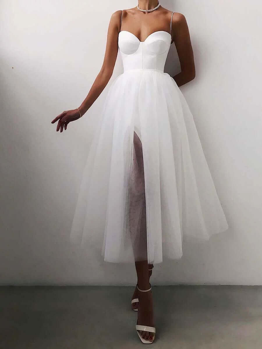 White elegant A-line midi dress for women. Versatile party & special occasion wear, timeless fashion.