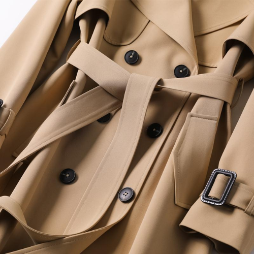 Stylish women's double-breasted long trench coat, elegant outerwear for fall & winter sophistication.