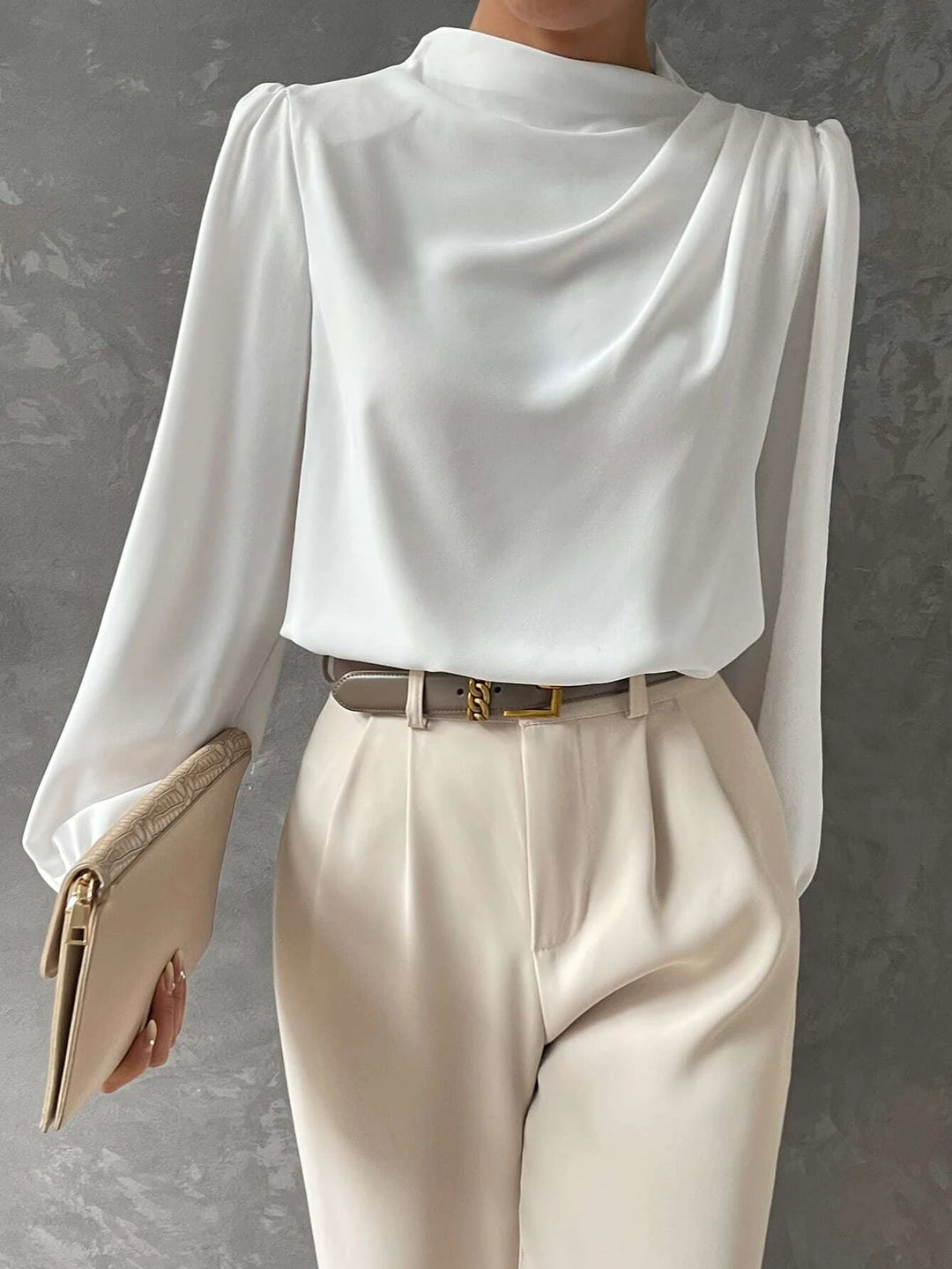 Chic bishop sleeves on a women's blouse. Elegant long sleeve top, perfect for stylish business casual fashion.
