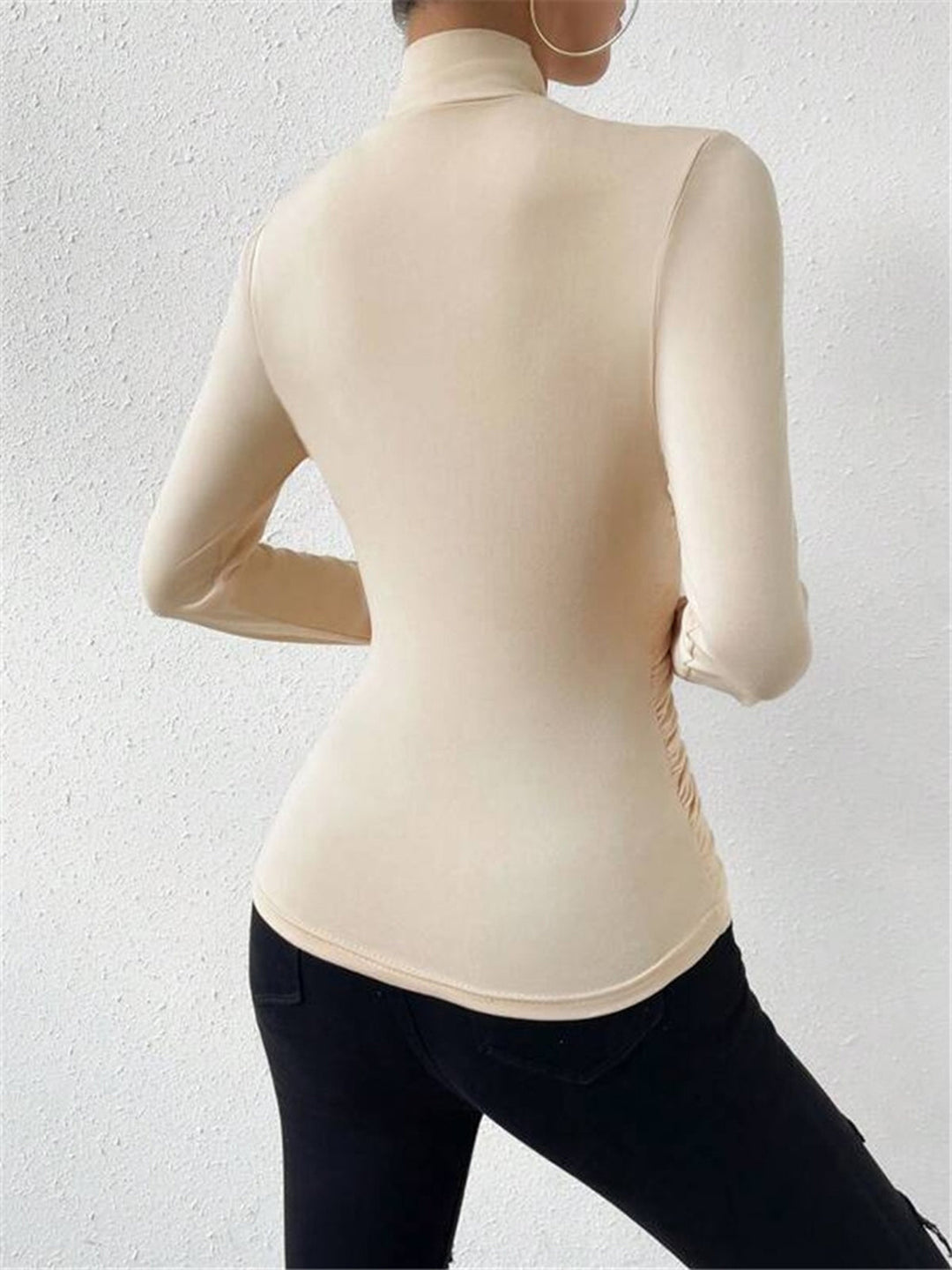 Versatile white women's long sleeve top with draped crossover design, ideal for casual or formal wear.