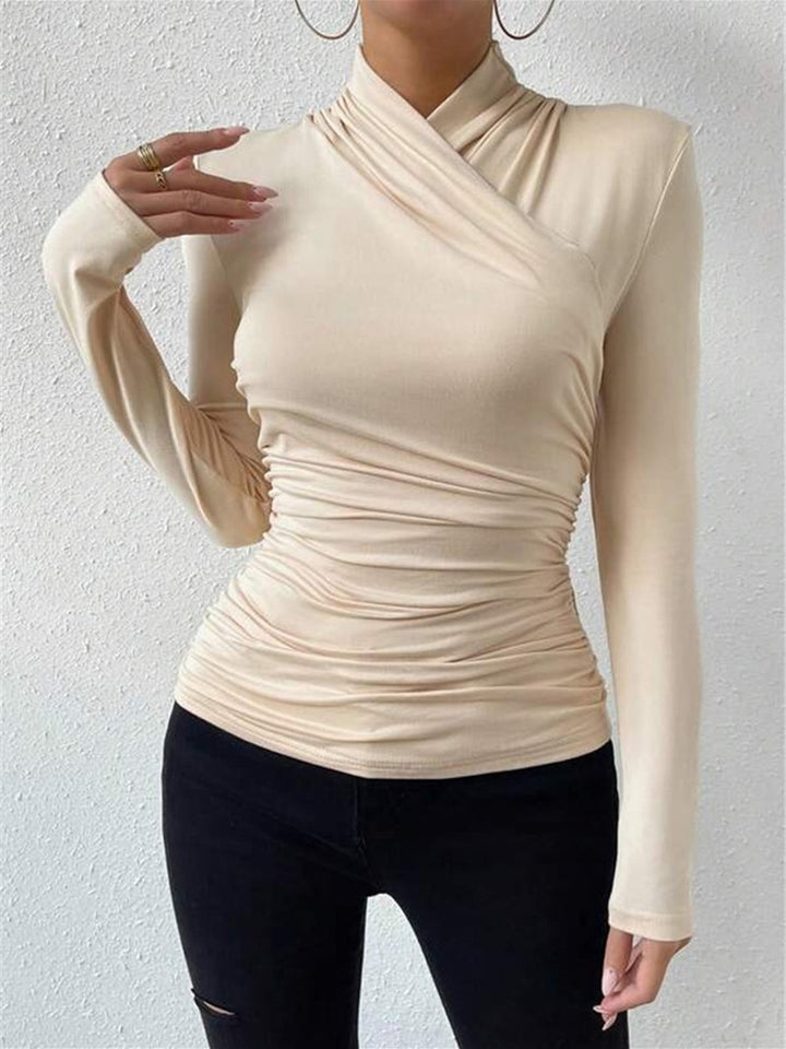 Women's sophisticated crossover long sleeve top with elegant drape, offering versatile style.
