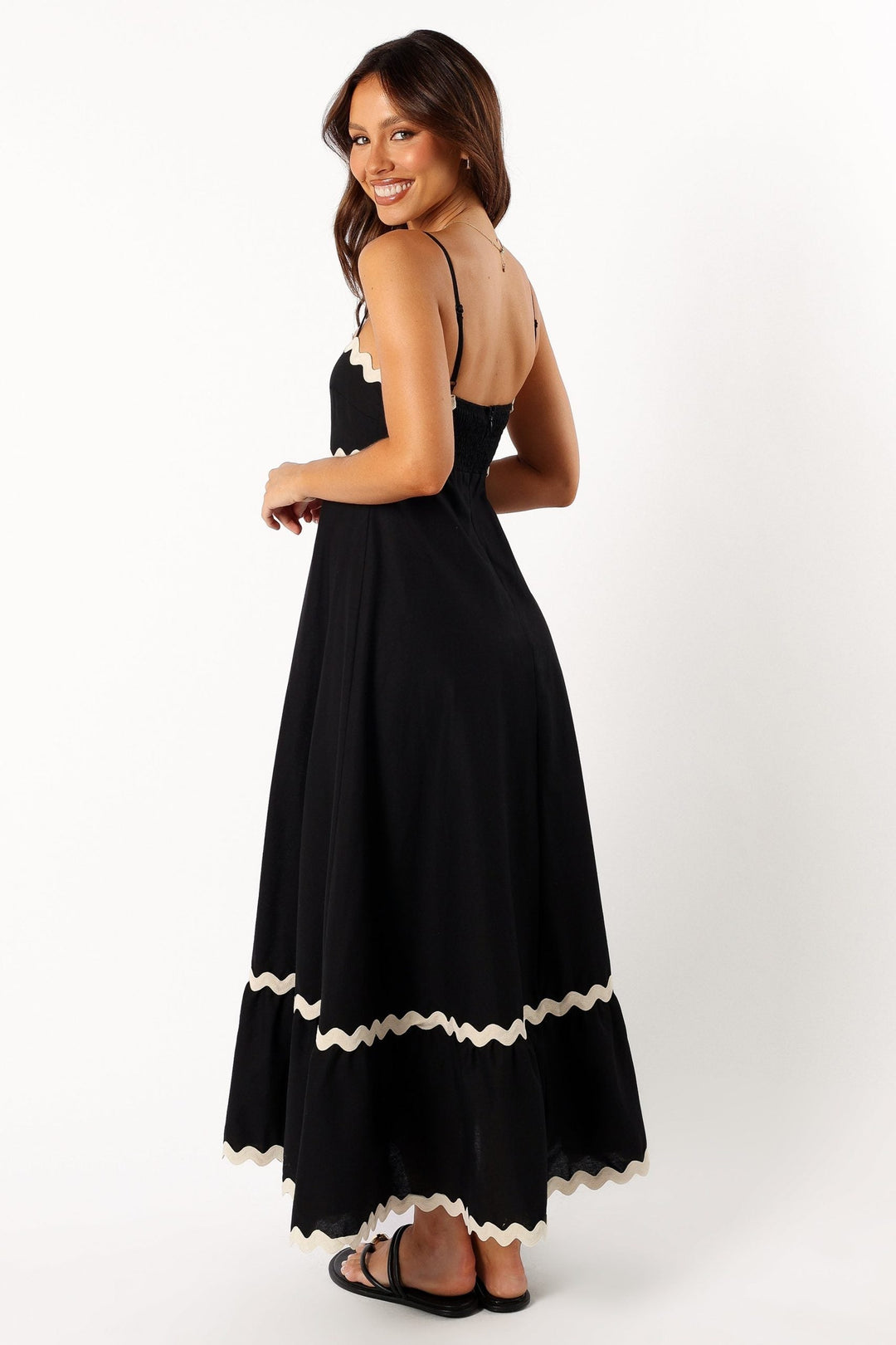 Flowy black maxi dress for women, offering comfortable and elegant summer style, perfect for resort or vacation wear.