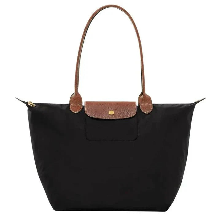 Stylish women's red crossbody bag with adjustable strap, crafted from synthetic leather. Versatile fashion accessory.