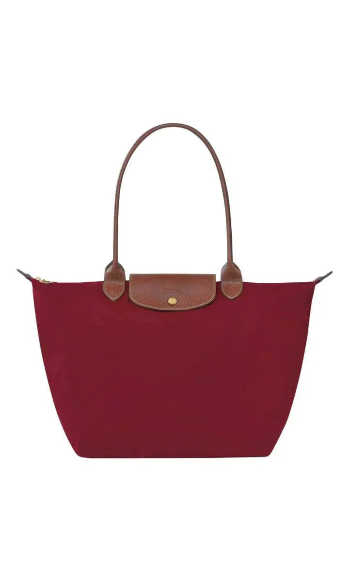 Navy blue elegant shoulder bag for women, made of synthetic leather. Features an adjustable strap for comfortable wear.