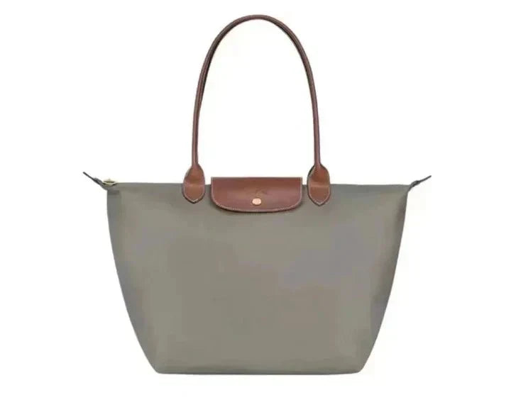 Sophisticated women's handbag, synthetic leather. Features elegant design & adjustable shoulder strap. Perfect accessory.