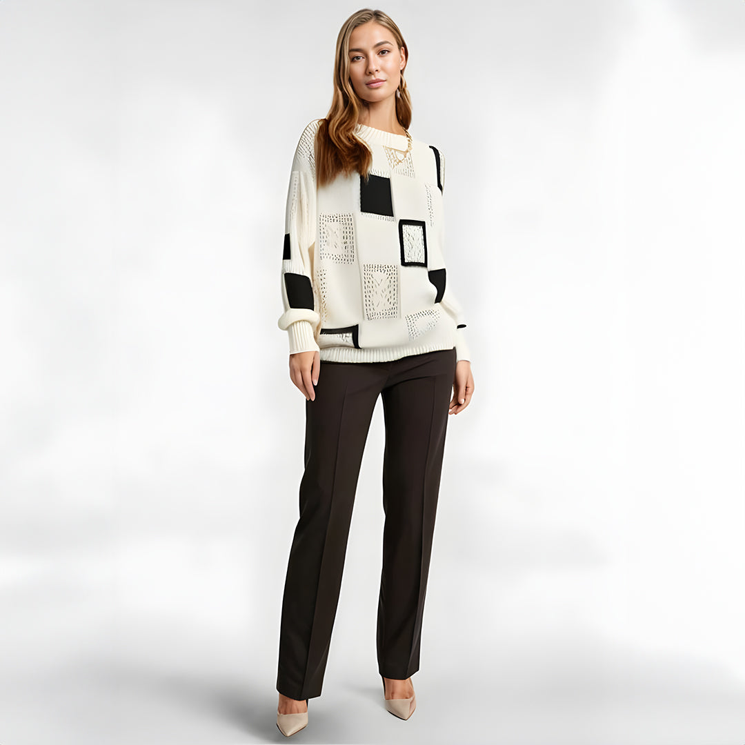 Warm & comfortable women's geometric winter sweater. Stylish black & white patchwork pullover jumper.