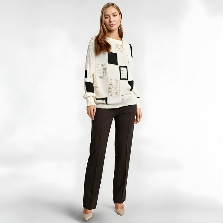 Warm & comfortable women's geometric winter sweater. Stylish black & white patchwork pullover jumper.