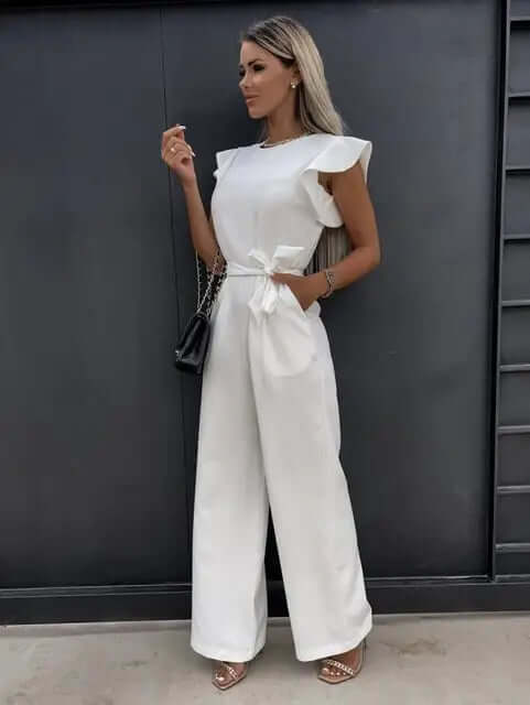 Fashionable women's wide-leg jumpsuit showcasing chic ruffled sleeves, an elegant & comfortable statement piece.
