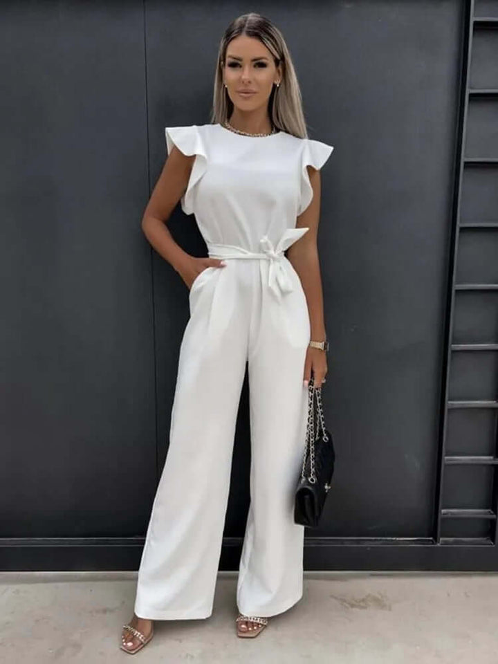 Modern women's wide-leg jumpsuit with ruffled sleeves, offering an elegant, comfortable, and stylish look.