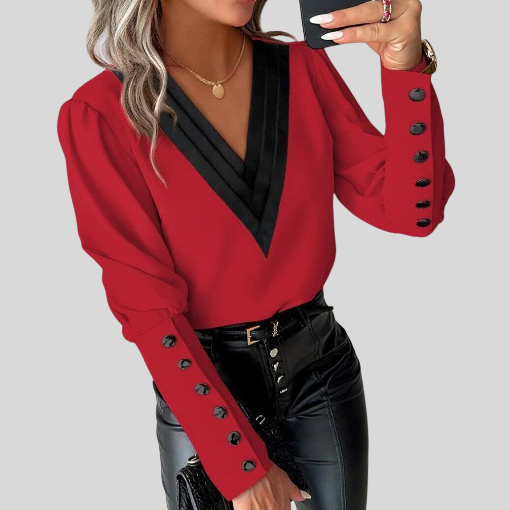 Elegant women's blouse with stylish gigot sleeves and a sophisticated button-front design, perfect for office or casual chic.