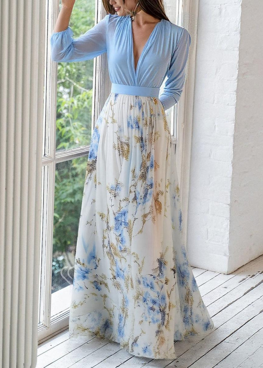 Flowy summer women's blue chiffon maxi dress with elegant floral print & V-neck long sleeves for evening wear.