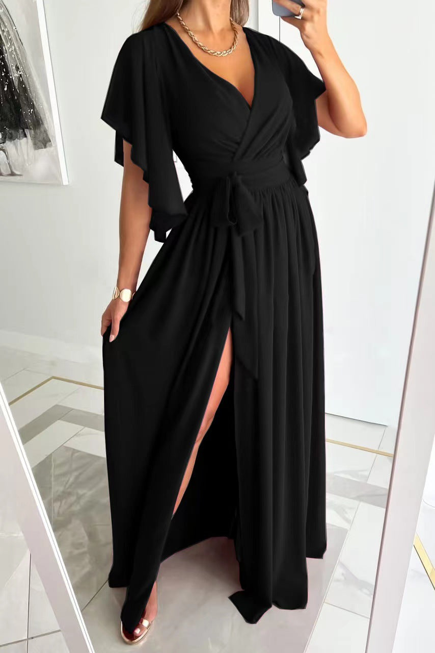 Flowy women's wrap maxi dress with flutter sleeves, styled elegantly for a bridesmaid or wedding guest look.