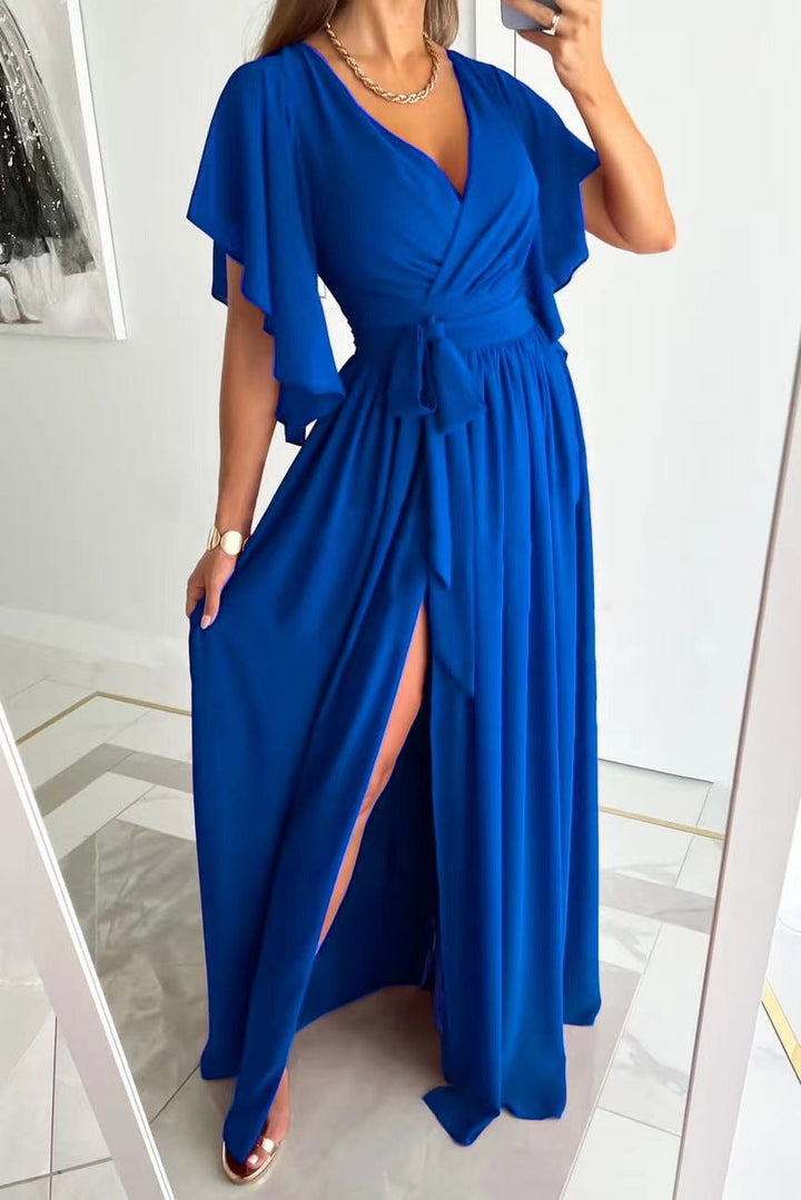 Close-up of a women's formal wrap maxi dress showcasing soft fabric, flattering V-neck, and delicate flutter sleeves.