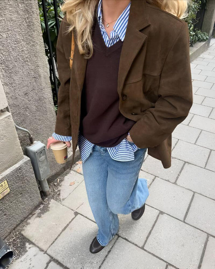 Chic women's versatile brown suede jacket, elegant outerwear for fashion and comfort.
