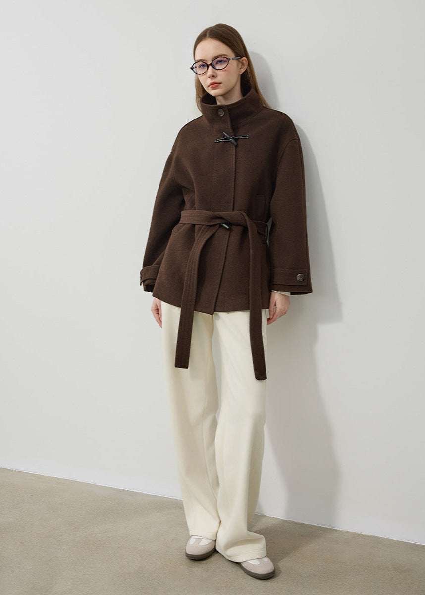 Stylish women's toggle coat in brown, featuring an elegant design & belted waist. Perfect classic winter outerwear.