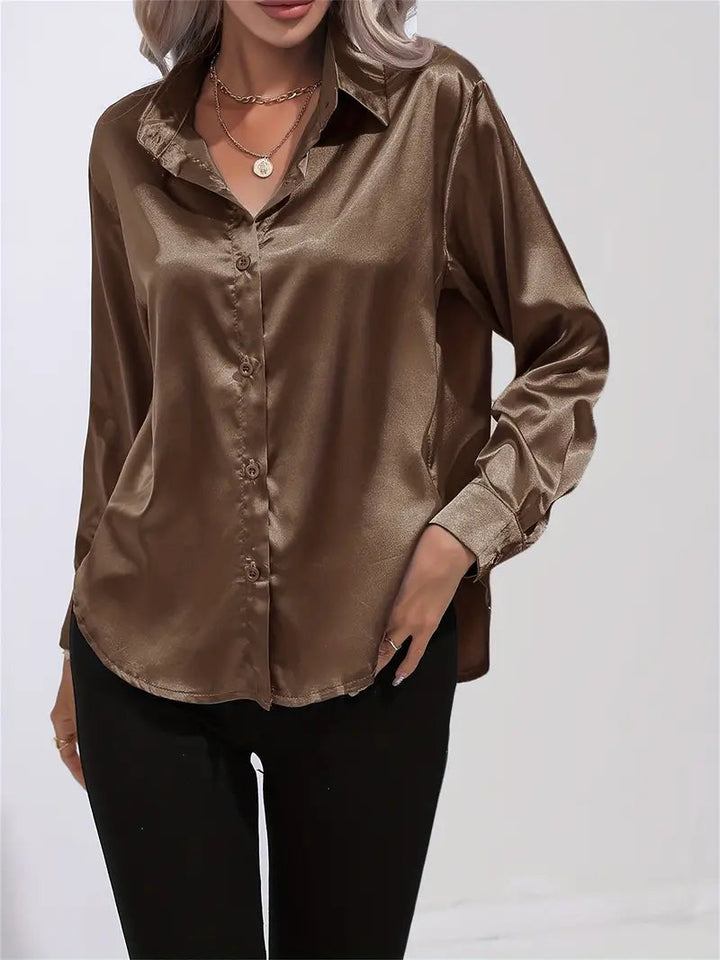 Versatile women's top, elegant button-down with long sleeves.