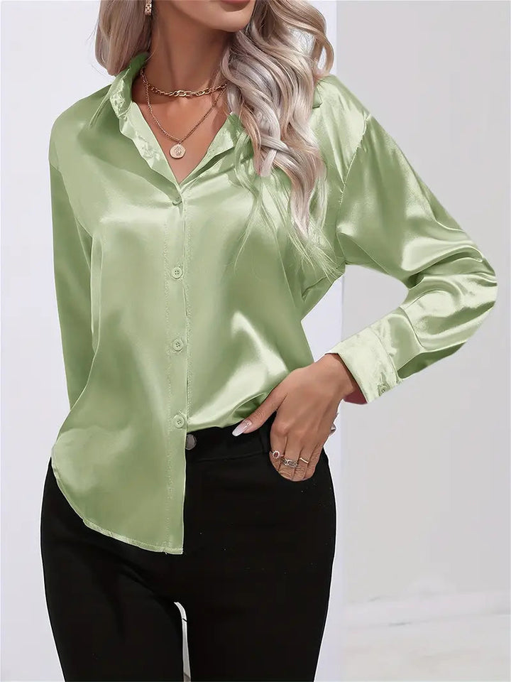Fashionable women's button-down blouse, perfect for any elegant occasion.