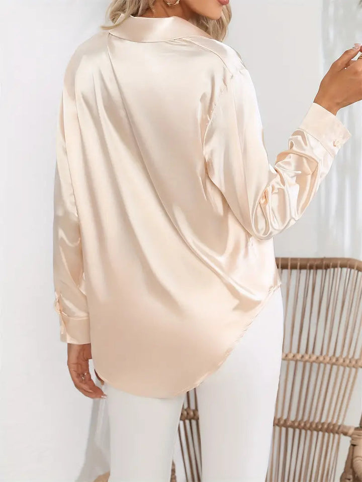 Chic women's button-down top, versatile for day-to-evening fashion.