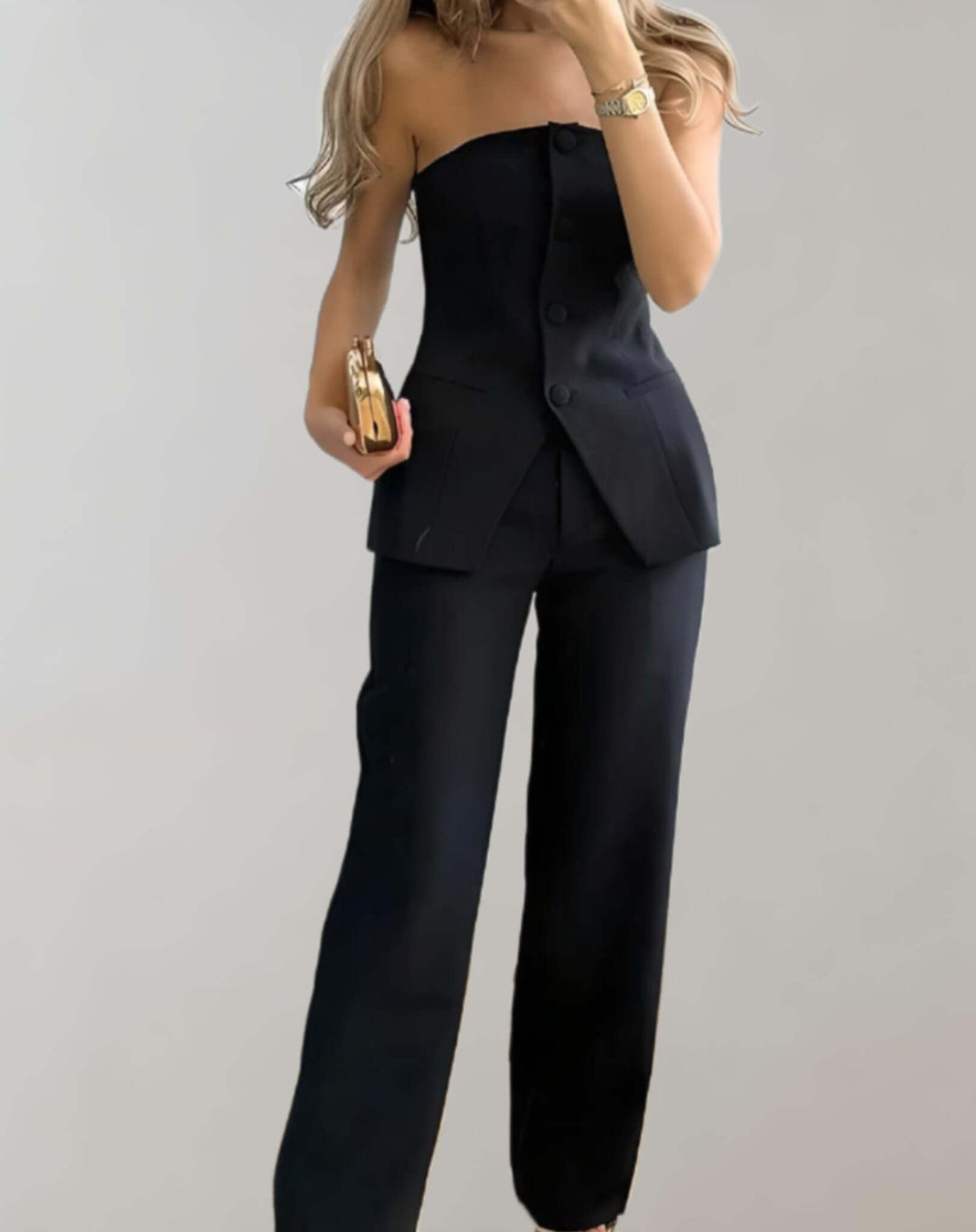 Close-up of women's tweed crop top and skirt set, showcasing unique woven fabric and button details.