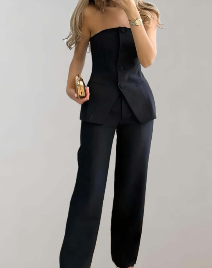 Close-up of women's tweed crop top and skirt set, showcasing unique woven fabric and button details.