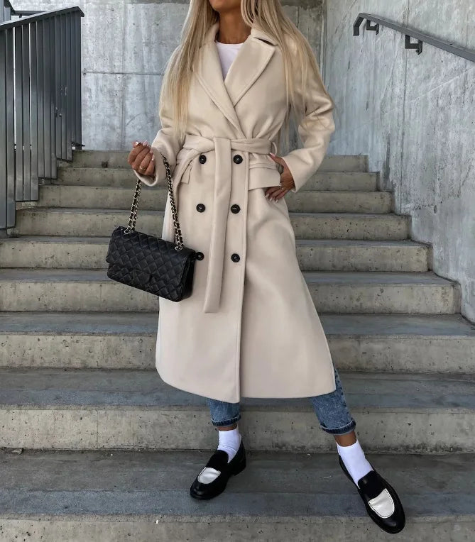 Detailed view of a women's trench coat, showcasing its classic style, elegant design, and quality fabric.