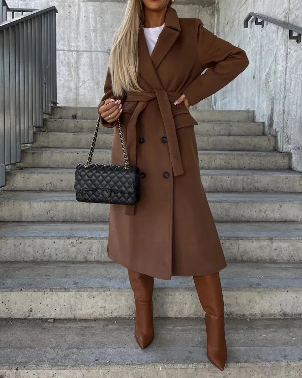 Stylish women's long sleeve trench coat, ideal for a layered look. Timeless outerwear for versatile fashion.