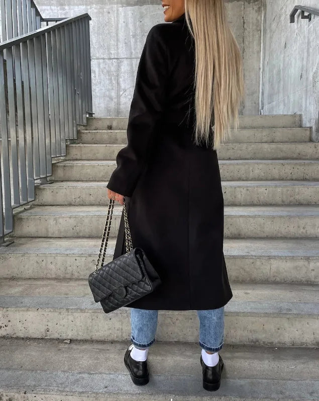 Side profile of an elegant women's long sleeve trench coat, perfect for a sophisticated, versatile fashion statement.