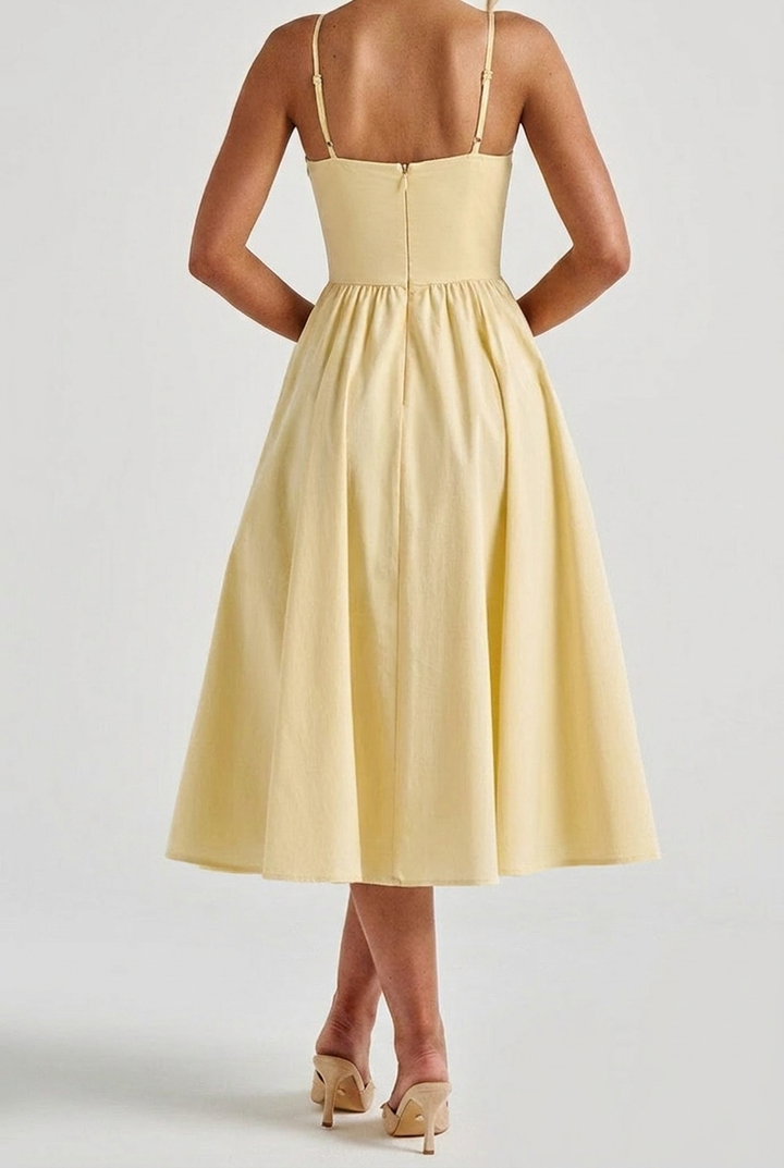 Chic women's corset midi dress, an elegant A-line formal wear piece with delicate spaghetti straps.