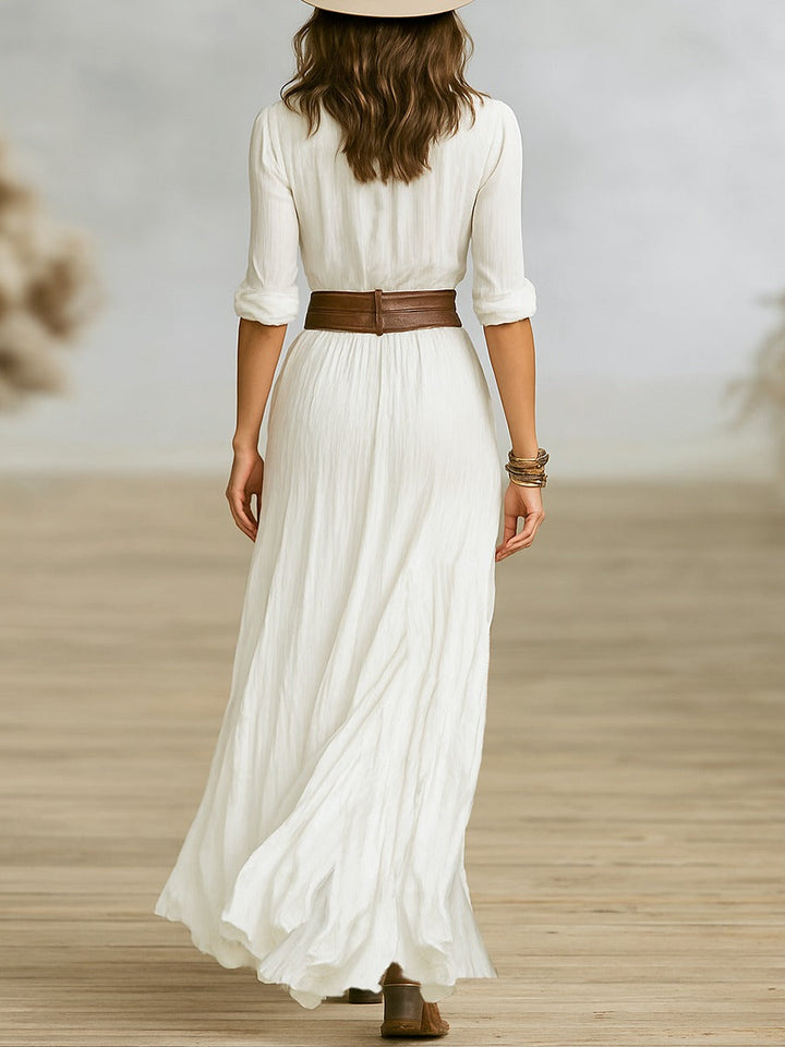Crissa #2212 Women's elegant long dress. Features pleated lapels & a flattering belted waist. Classic fashion.