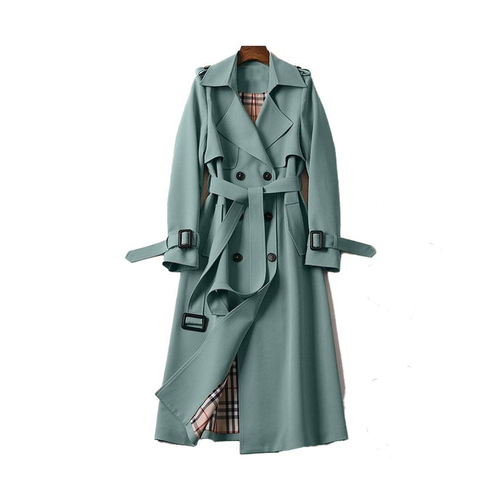 Fashionable women's double-breasted trench coat with a cinched belt, showcasing a sophisticated winter outerwear look.