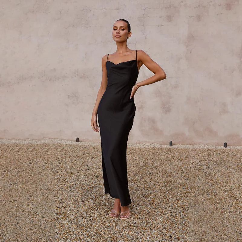 Elegant women's draped maxi dress, perfect for special occasions like weddings or evening events. Flowy, long design.