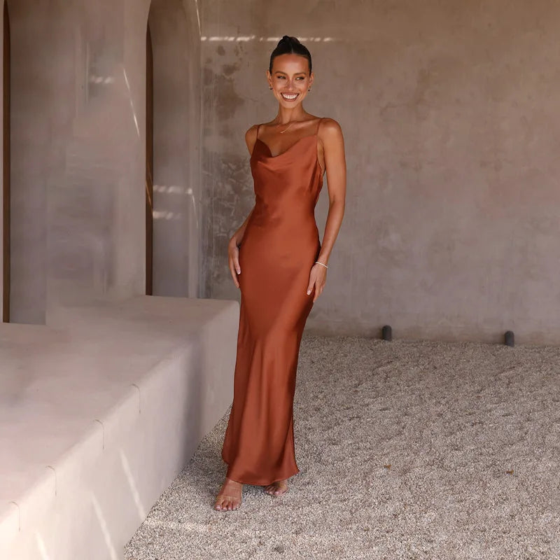 Women's elegant draped neck maxi dress with delicate spaghetti straps, ideal for formal wear and summer events.
