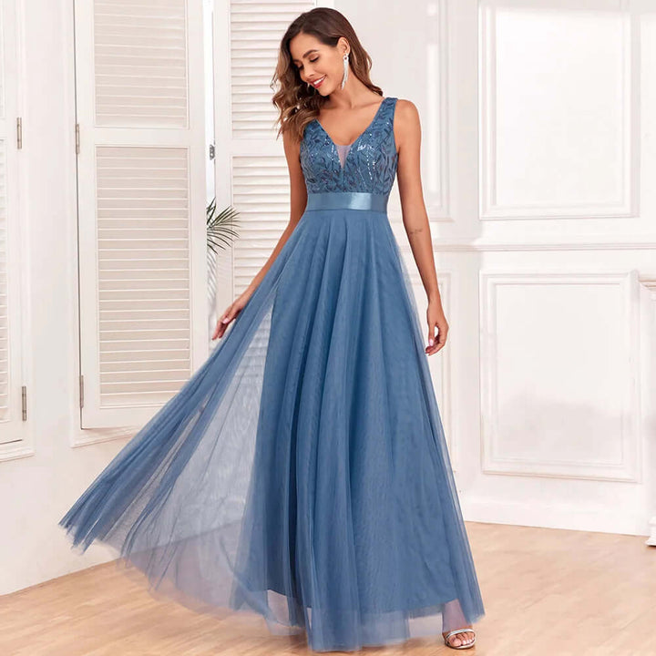 Stunning blue floor-length V-neck formal dress with intricate embroidery. Ideal for proms and events.