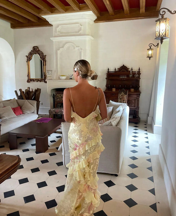 Fashionable women's ruffle maxi dress, a chic and elegant flowing gown. Ideal for romantic evening wear.