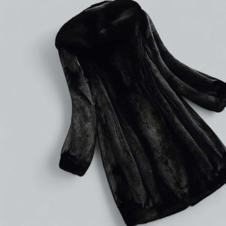 Warm & elegant women's faux fur hooded long winter coat. Perfect cold weather outerwear for luxury fashion.