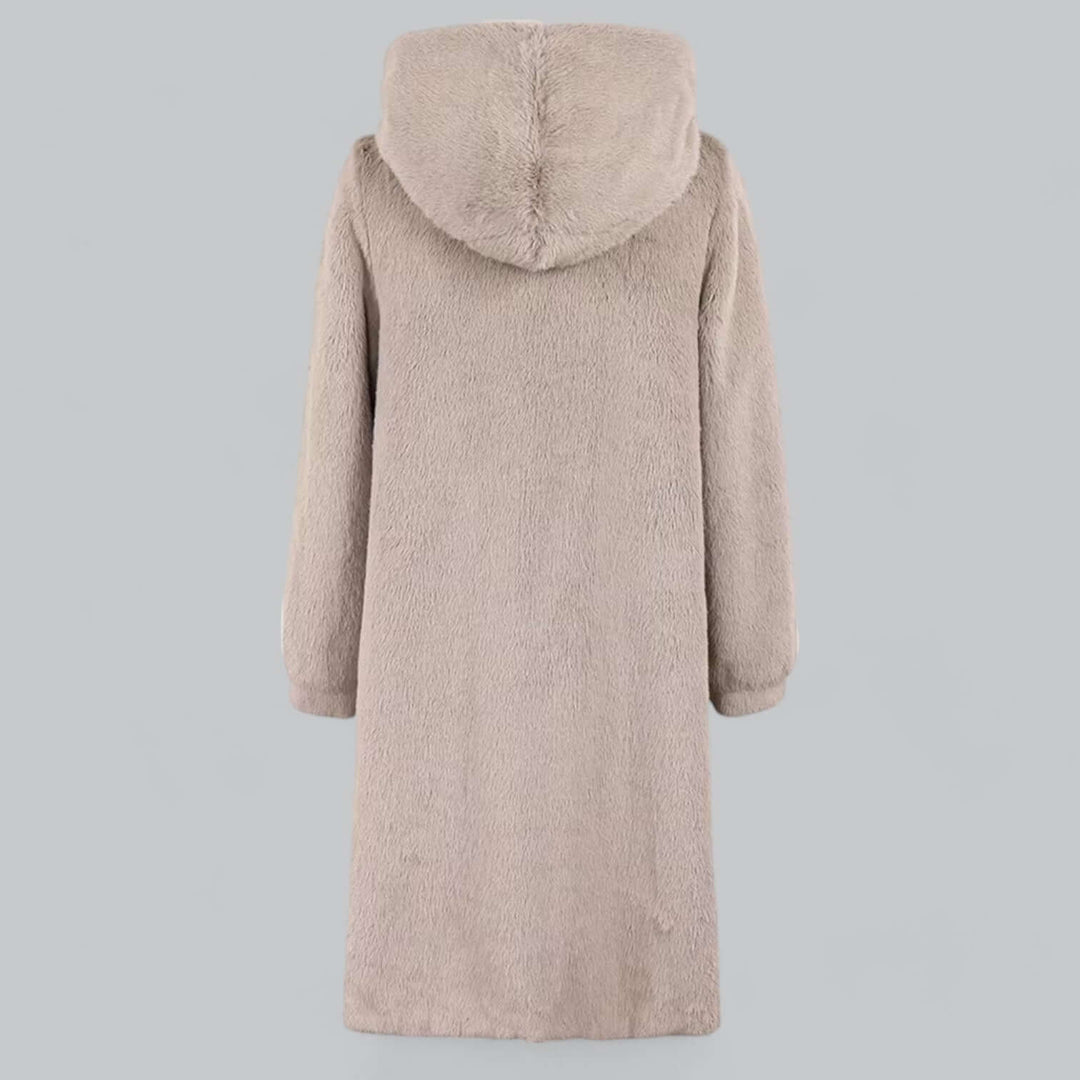 Full-length women's hooded faux fur winter coat. Elegant, warm, and fashionable outerwear for winter comfort.